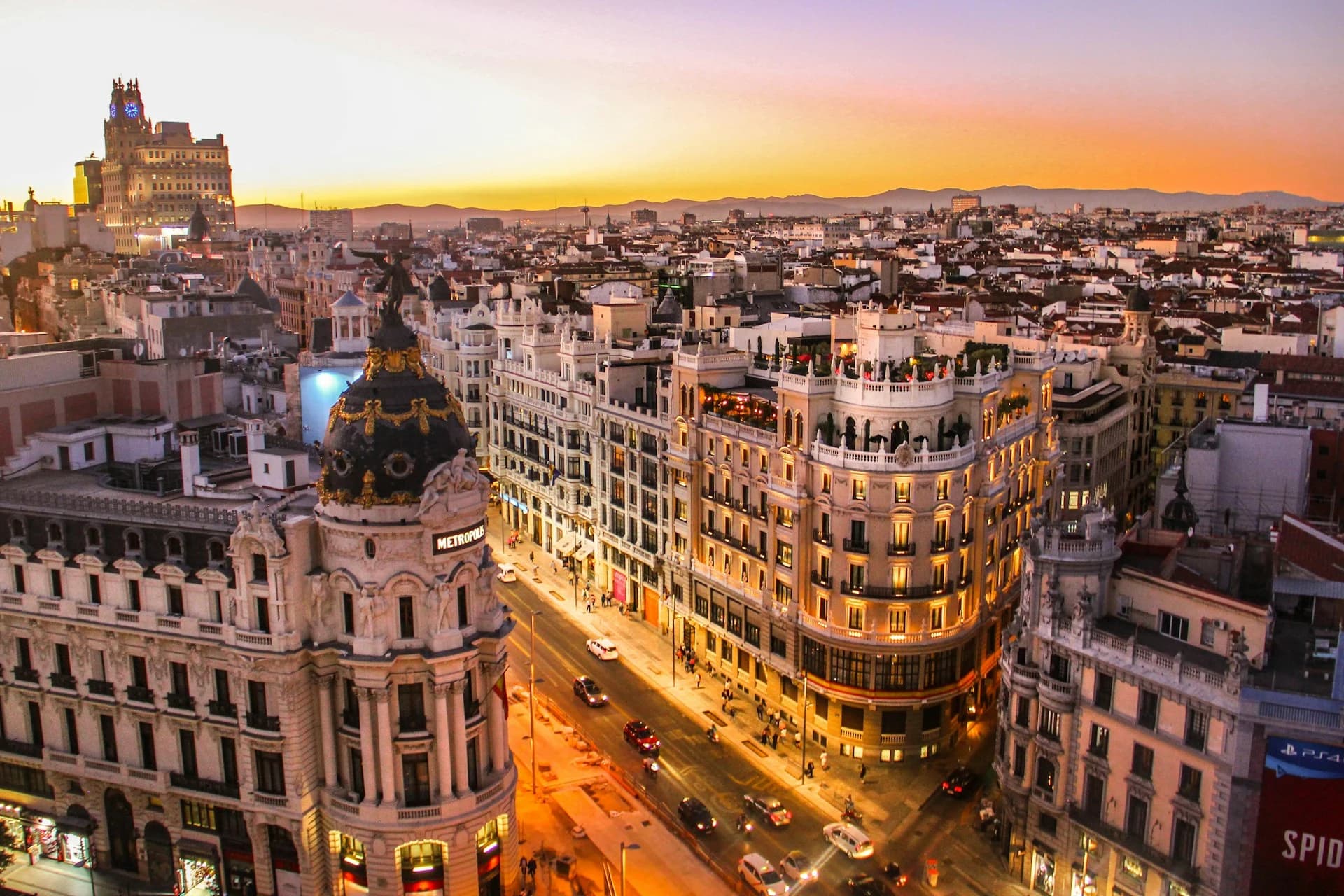 Golden-hour city street scene in Madrid